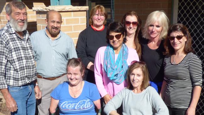 Staff from St John Paul II Catholic College visited Jodie in Richmond, from left: Michael Greenaway, Andrew Noney, Janet Hammond, Fay Lovett, Karen Smith, Jodi Thomas, Josette Woolley; Sitting: Jodie and Georgia Fitzgerald