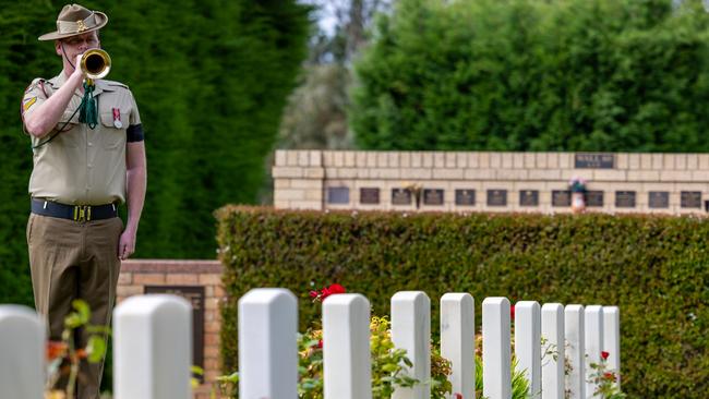 Australian Army Band bugler Corporal Joshua Young sounds the Last Post during the reinterment ceremony for World War I veteran Private Edward Ruffles at the Cornelian Bay Cemetery in Hobart on Thursday. Picture: Corporal Michael Currie