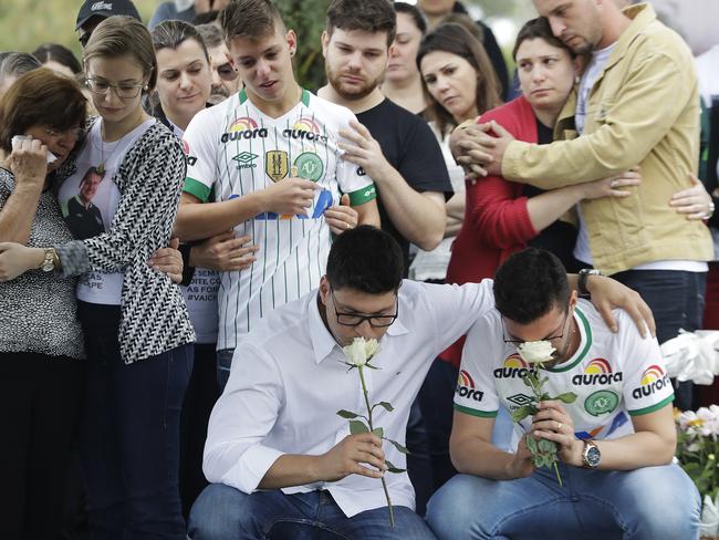 Relatives attend the burial of Chapecoense soccer team's late president Sandro Pallaoro. Picture: Andre Penner/AP