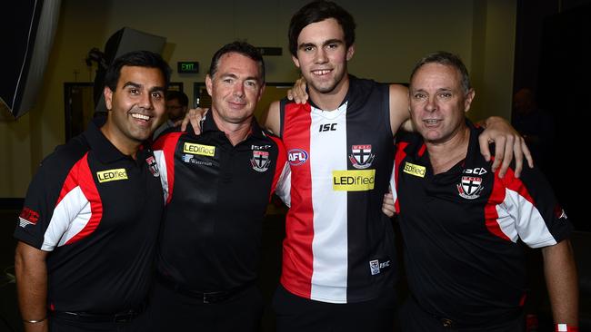 St Kilda’s recruiting team (from left) Ameet Baines, Alan Richardson and Tony Elshaug with 2014 No.1 draft pick Paddy McCartin. Picture: Stephen Harman