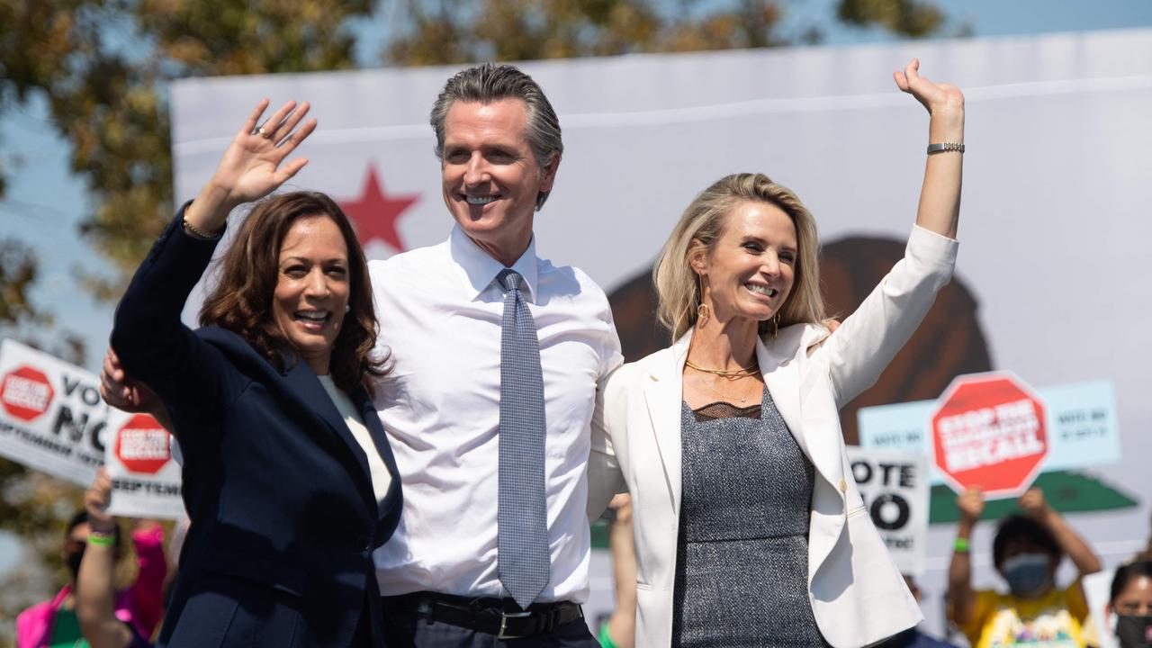 US Vice President Kamala Harris stands with California Governor Gavin Newsom and his wife Jennifer Seibel Newsom (right). (Photo by SAUL LOEB / AFP)