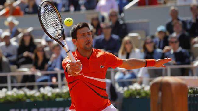 Novak Djokovic hits a return to Dominic Thiem. Picture: AP