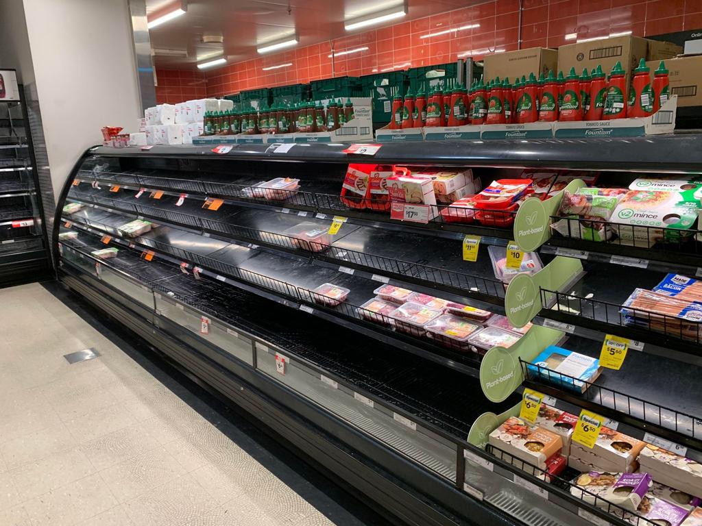 Shoppers are finding many vacant shelves at Woolworths Rural View as Covid-19 disrupts the supply chain. Picture: Tara Miko