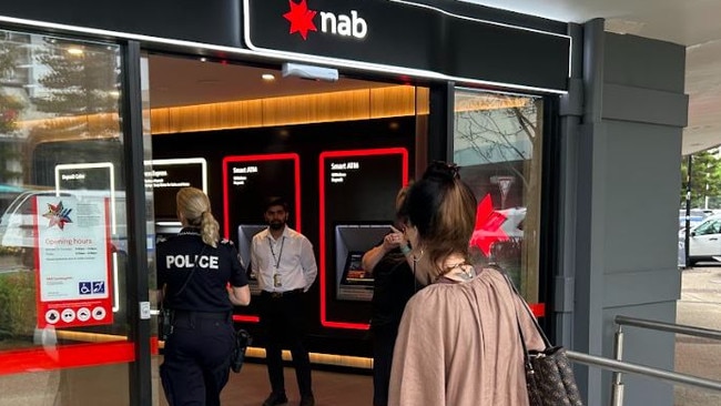 Police investigate a robbery at NAB on Griffith Street, Coolangatta, on Tuesday.