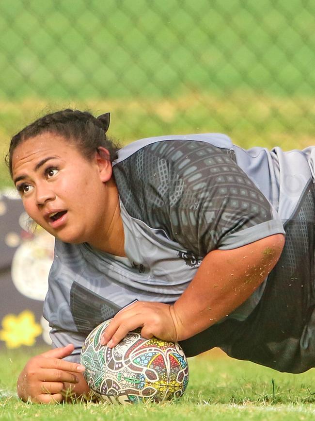 Mele Tapuala scores as the Indigenous All Stars take on the Territory All Stars in the senior women's rugby league Deadly Cup. Picture: Glenn Campbell