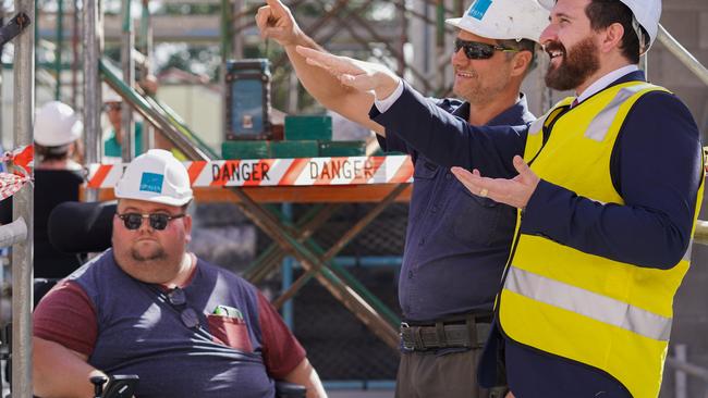 Participant Brendon Woolf, Steve Soberon from Opalyn Constructions and Cr Tony Hall inspect the new building at Neridah St, Loganlea.