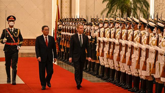 China's Premier Li Qiang and New Zealand Prime Minister Chris Hipkins inspect the guard of honour during a welcoming ceremony at the Great Hall of the People in Beijing. Picture: Jade Gao/Pool/AFP