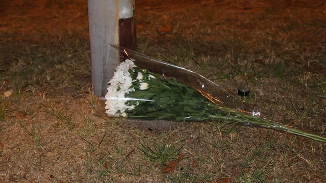 Flowers left at the scene of the stabbing on Sunday night. Picture: Riley Walter