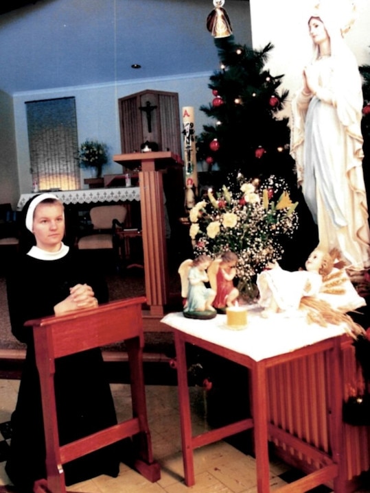 Former nun Helen Whait prays at Christmas. Picture: supplied