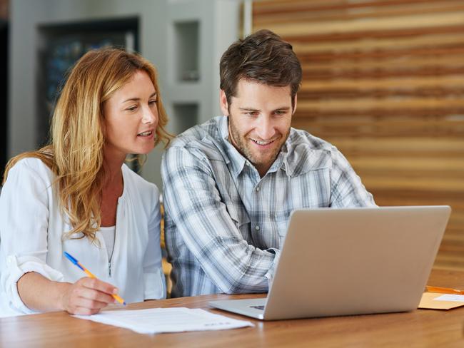 A couple sitting at the kitchen table discussing their household bills. Picture: iStock.