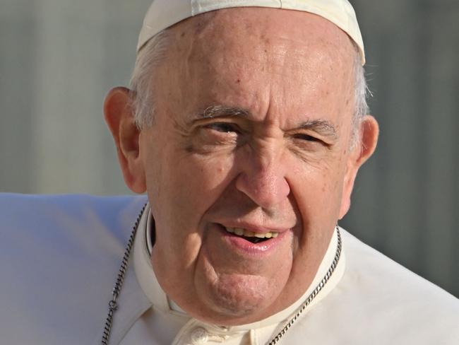 (FILES) Pope Francis arrives for the weekly general audience on October 19, 2022 at St. Peter's square in The Vatican. Pope Francis "rested well" the Vatican said on February 25, 2025, as the critically-ill pontiff is in hospital with double pneumonia. (Photo by Alberto PIZZOLI / AFP)