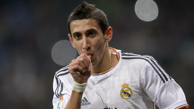 (Files) In this file picture taken on December 18, 2013, Real Madrid's Argentinian midfielder Angel di Maria celebrates after scoring during the Spanish Copa del Rey (King's Cup) finals stage second-leg football match against Olimpic Xativa at the Santiago Bernabeu stadium in Madrid. Manchester United have signed Argentina midfielder Angel di Maria from Real Madrid for a British record transfer fee of £59.7 million ($98 million, 75 million euros), the English Premiership club announced Tuesday, August 26, 2014. The 26-year-old's move, on a five-year contract, shatters the previous British record fee of £50m paid by Chelsea to sign Spain striker Fernando Torres from Liverpool in 2011. AFP PHOTO/ DANI POZO