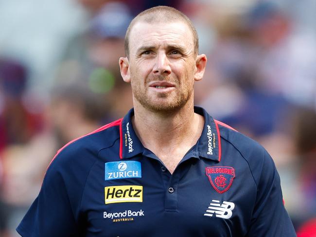 MELBOURNE, AUSTRALIA - MARCH 17: Simon Goodwin, Senior Coach of the Demons looks on at half time during the 2024 AFL Round 01 match between the Melbourne Demons and the Western Bulldogs at the Melbourne Cricket Ground on March 17, 2024 in Melbourne, Australia. (Photo by Dylan Burns/AFL Photos via Getty Images)