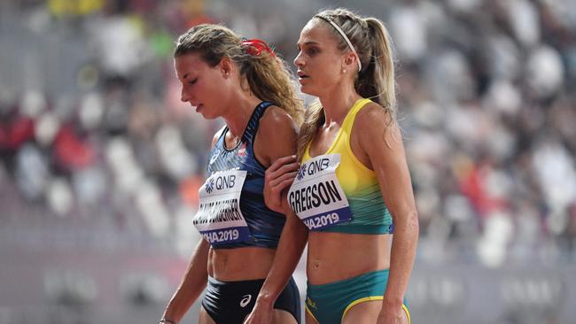 France's Ophelie Claude-Boxberger and Australia's Genevieve Gregson walk from the track after the Women's 3000m steeplechase heats. (Photo by Jewel SAMAD / AFP)