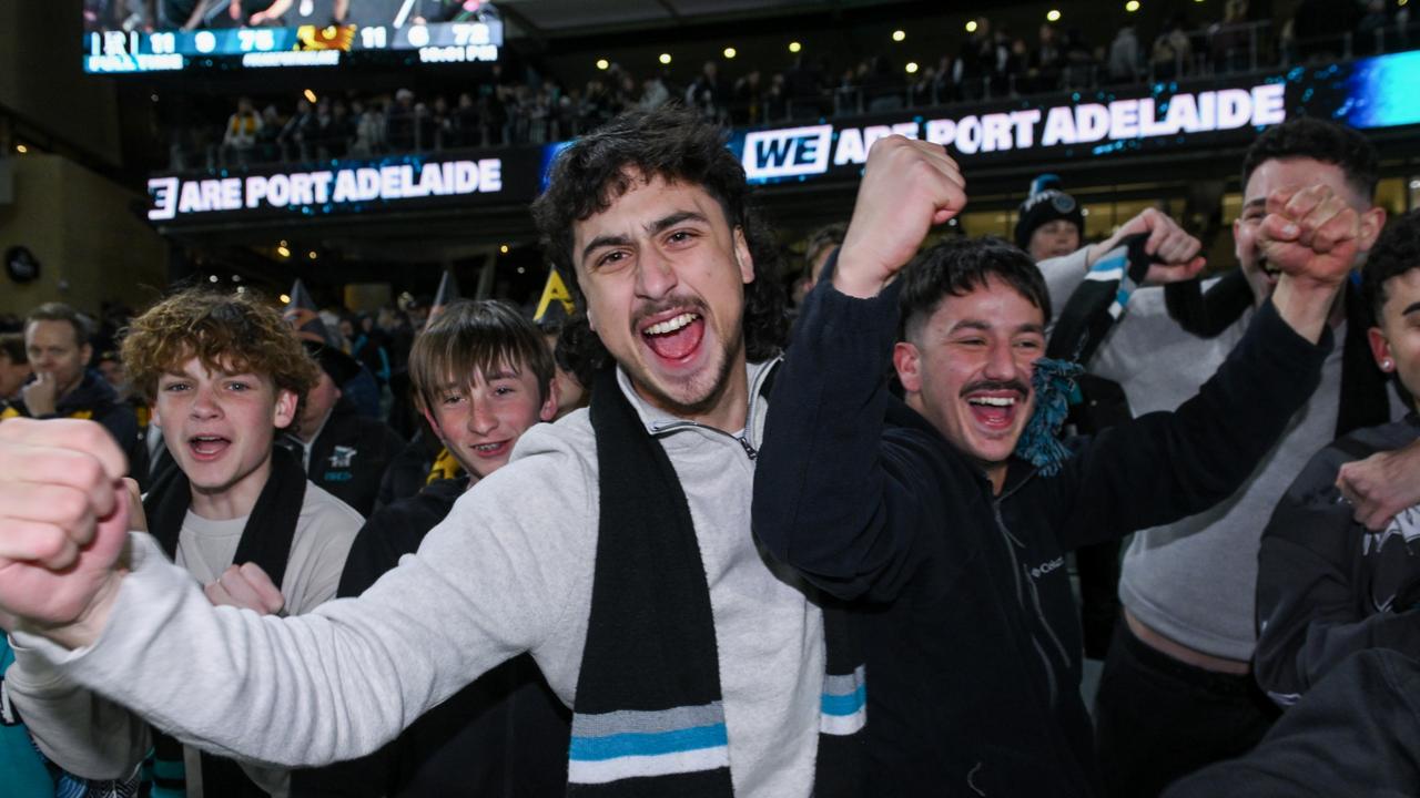 Power fans celebrate a famous 3 point victory over Hawthorn at Adelaide Oval. Picture: Mark Brake