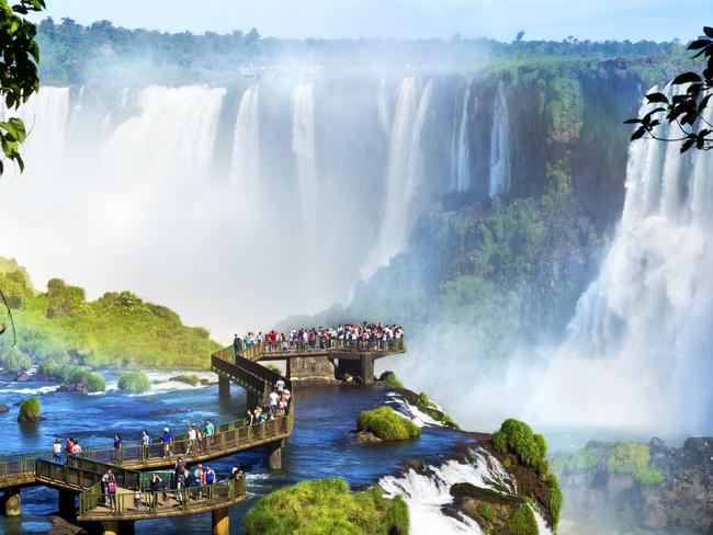 ESCAPE: WISHLIST WATERFALLS - Tourists at Iguazu Falls, one of the world's great natural wonders, on the border of Brazil and Argentina. Picture: Istock