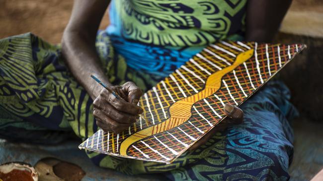 A Tiwi artist at work on Bathurst Island. Picture: Tourism NT