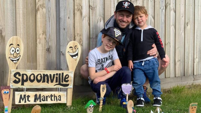 Cameron Sweatman with the sign he created for Spoonville Mt Martha.