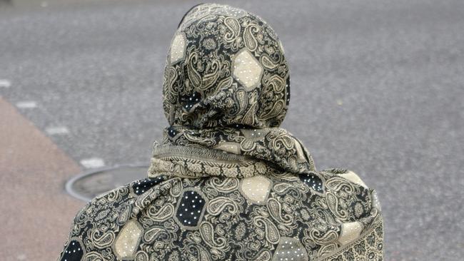 The woman was tripped over by a man who also tried to remove her hijab (Stock image). Picture: Alamy