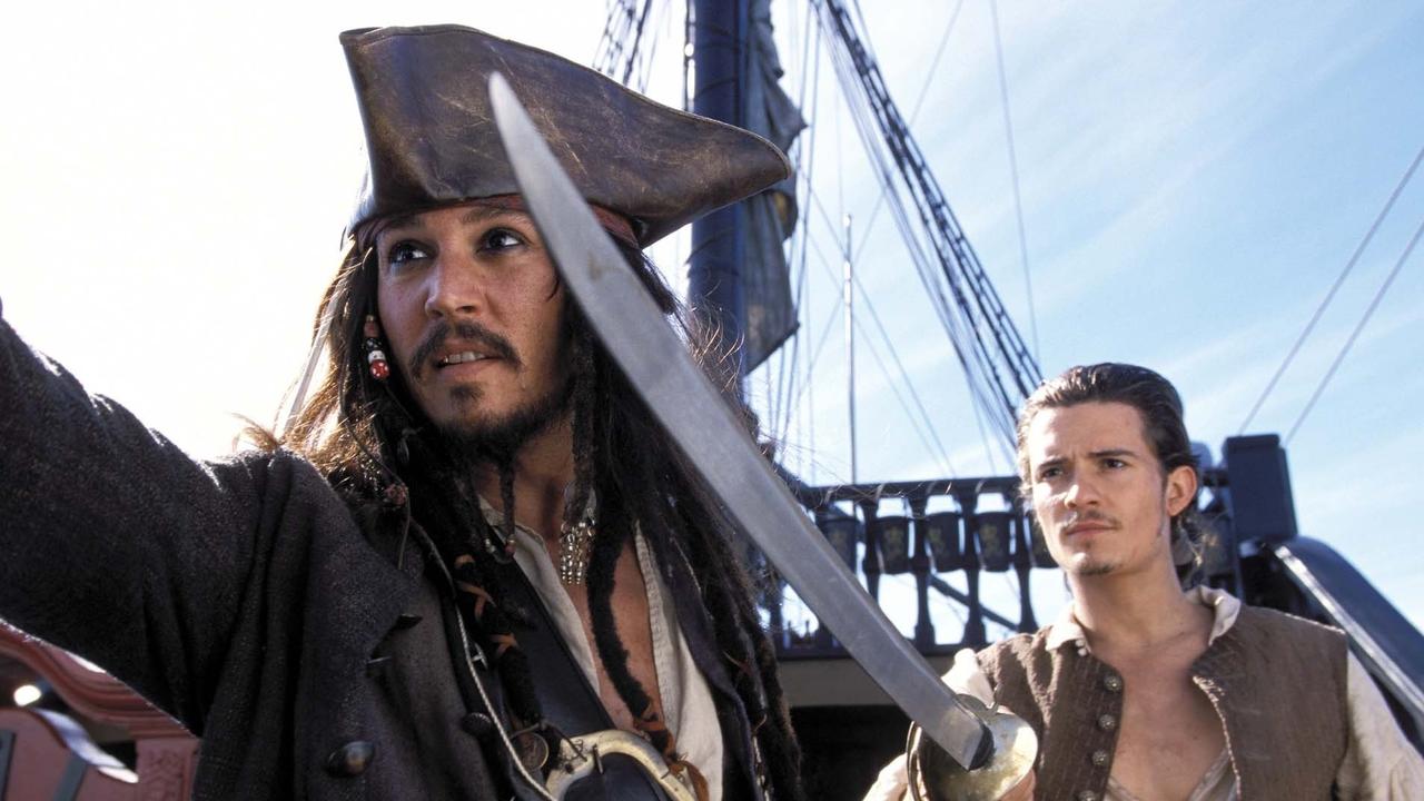 Johnny Depp as Captain Jack Sparrow, left, and Orlando Bloom as Will Turner join forces in Walt Disney's "Pirates of the Caribbean: The Curse of the Black Pearl. Picture: AP Photo/Elliot Marks