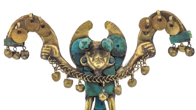 Gold and turquoise nose ornament depicting figure with half-moon and club-head headdress, circular ear ornaments and loincloth, holding a rattle.. From the Mochica culture.