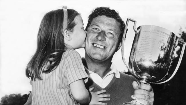 Image from HWT book 'MOMENTS IN TIME'. Portrait gallery. Golfer Peter Thomson with his daughter Peta Ann. Australian PGA championshion at Metropolitan.