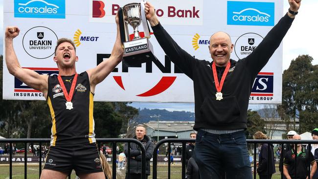 Balwyn captain Charlie Haley and coach Brenton Sanderson hold the Premier Division cup aloft. Picture: Davis Harrigan