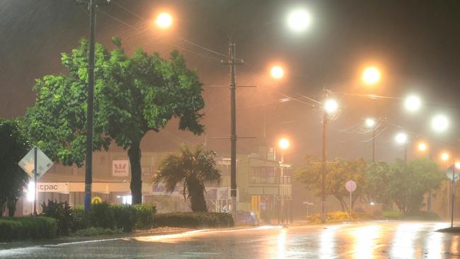 The main street of Bowen begins to feel the first effects of driving rain and strong winds of tropical cyclone Debbie. Picture: Lyndon Mechielsen/The Australian