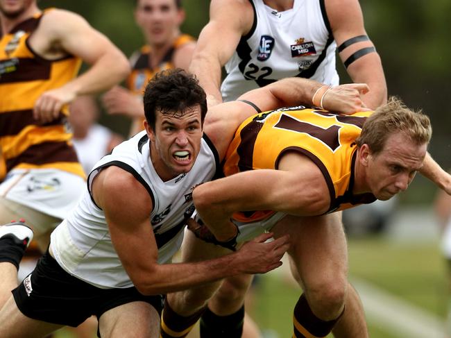 NEAFL match between Southport and Aspley — Southports Ben Merrett and Aspley's Gavin Grose Pic by David Clark