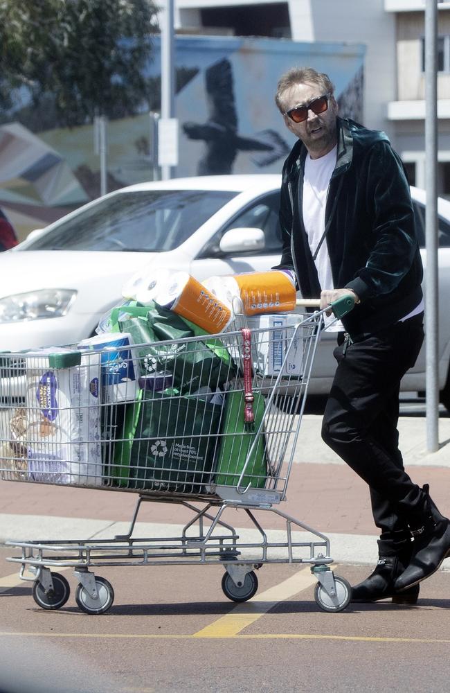 Cage stocked up on nappies and other supplies at the Woolworths store. Picture: Ghosty / BACKGRID