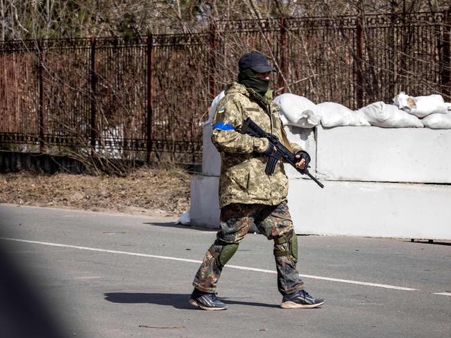 A volunteer patrols at a checkpoint in Stoyanka amid the Russian invasion of Ukraine. Picture: AFP