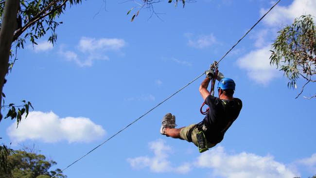 A man enjoying a zipline.