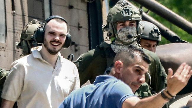 Israeli hostage Andrei Kozlov, 27, disembarks with soldiers from an air force CH-53 Sea Stallion military helicopter which landed in the grounds of the Sheba Tel-HaShomer Medical Centre, after his rescue by the Israeli army from captivity in the Gaza Strip. Picture: AFP