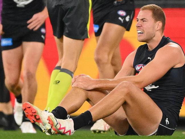 MELBOURNE, AUSTRALIA - JULY 15: Harry McKay of the Blues reacts to an injury during the 2023 AFL Round 18 match between the Carlton Blues and the Port Adelaide Power at Marvel Stadium on July 15, 2023 in Melbourne, Australia. (Photo by Morgan Hancock/AFL Photos via Getty Images)