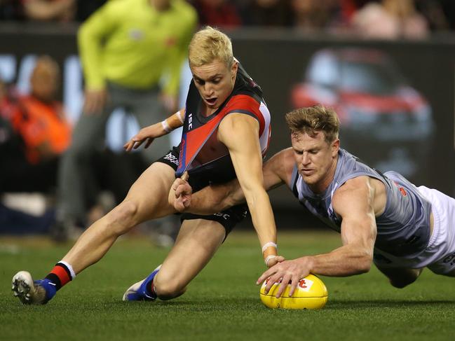 Essendon's Orazio Fantasia battles at ground level with Port Adelaide’s Tom Jonas at Marvel Stadium. Picture: Michael Klein