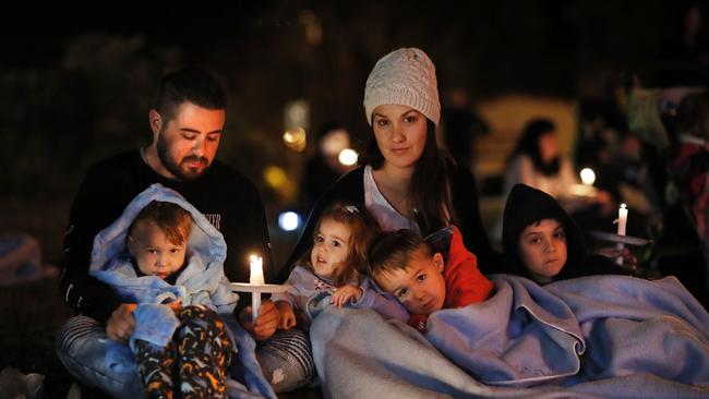 Michael and Sally Grayson with Jazz, Isla, Luca and Dominic at a candlelight vigil.  Picture: AAP Image/Josh Woning