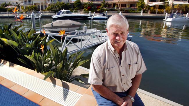 Motorsports legend Dick Johnson pictured in 2004 by the pool at his Sovereign Islands home. Picture: Mark Cranitch