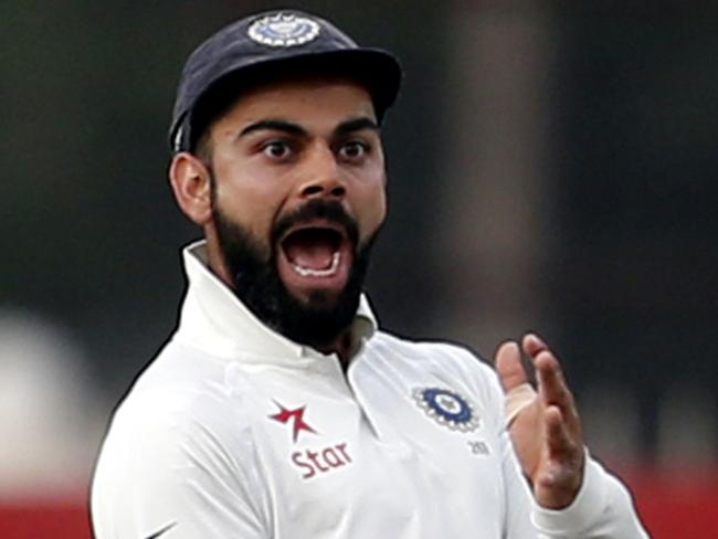 India's captain Virat Kohli gestures towards Australia's Matt Renshaw as he runs to celebrate the dismissal of David Warner during the fourth day of their third test cricket match in Ranchi, India, Sunday, March 19, 2017. (AP Photo/Aijaz Rahi)