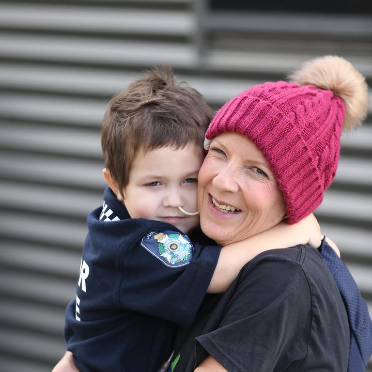 All worn out. Slater Clifton with his mum Bianca Walker. Picture: Glenn Hampson