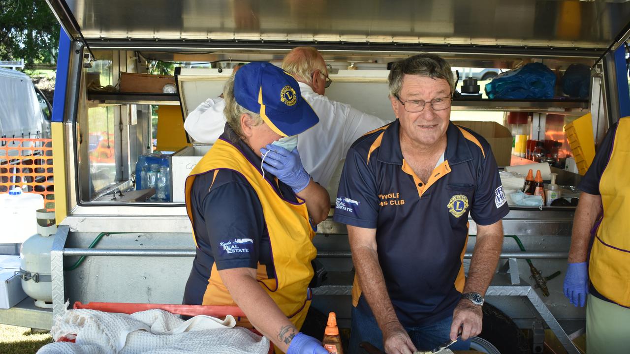 Roz Knight and Steve Darragh from the Kyogle Lions Club prepping the damper for the the Australia Day ceremony in Kygole.