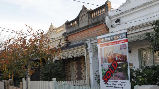 A 'sold' sign in front of a terrace home for sale in the inner-northern suburb of Brunswick in Melbourne, Monday, May 6, 2013. (AAP Image/David Crosling) NO ARCHIVING