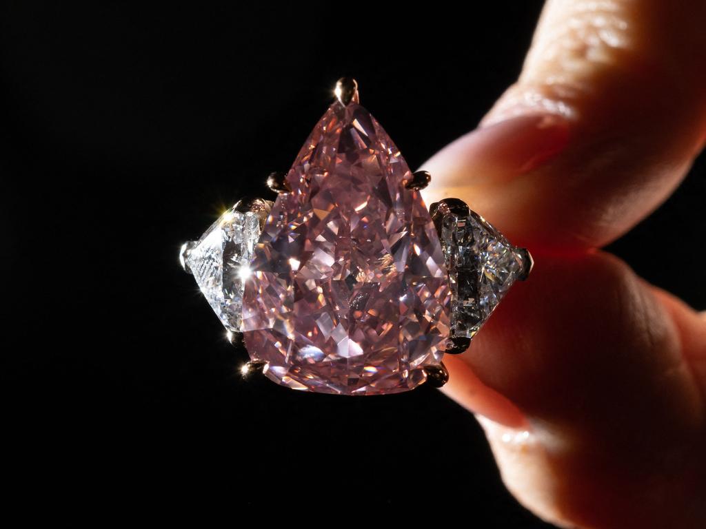 At over 18 carats, the vividly coloured gem is the largest pear-shaped pink diamond of its quality ever to be offered for sale at auction. (Photo by Fabrice COFFRINI / AFP)