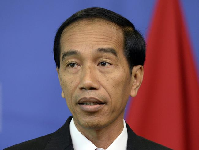 Indonesian president Joko Widodo gives a press conference following his meeting with European Union officials at the European Parliament in Brussels, on April 21, 2016. / AFP PHOTO / THIERRY CHARLIER