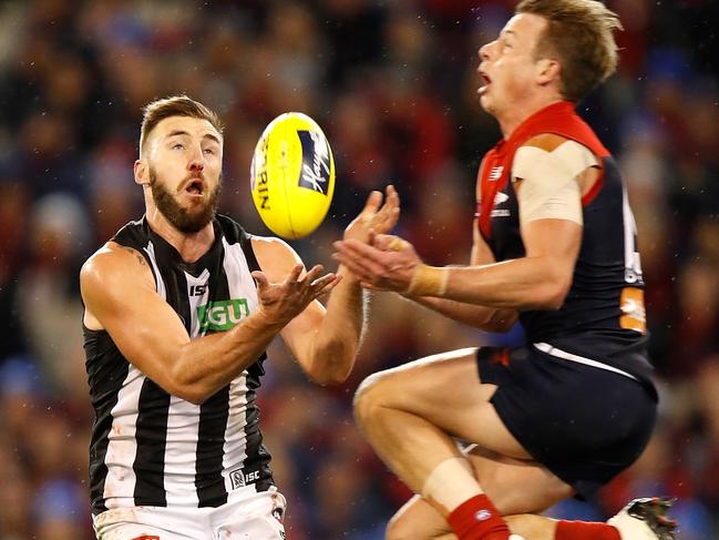 MELBOURNE, AUSTRALIA - JUNE 12: Lynden Dunn of the Magpies and Mitch Hannan of the Demons collide during the 2017 AFL round 12 match between the Melbourne Demons and the Collingwood Magpies at Melbourne Cricket Ground on June 12, 2017 in Melbourne, Australia. (Photo by Michael Willson/AFL Media/Getty Images)