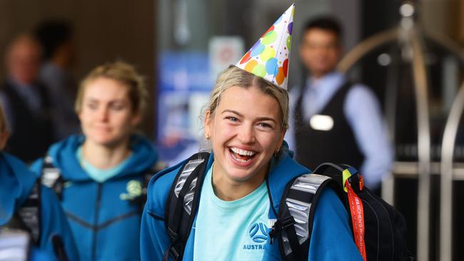 Charlotte Grant is all smiles as Matildas players depart the team hotel in Brisbane on Sunday after Saturday’s history-making quarter final win over France. Picture Lachie Millard