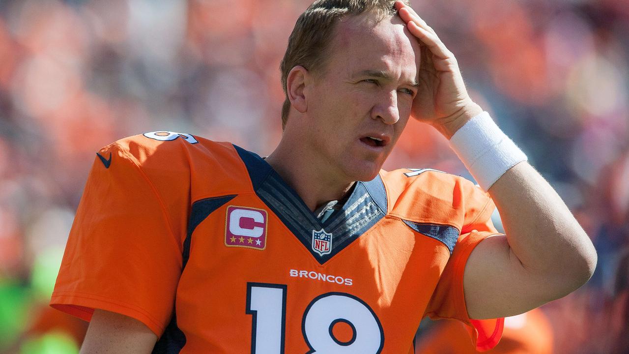 DENVER, CO - OCTOBER 5: Quarterback Peyton Manning #18 of the Denver Broncos wipes his brow before the start of a game against the Arizona Cardinals at Sports Authority Field at Mile High on October 5, 2014 in Denver, Colorado. Dustin Bradford/Getty Images/AFP == FOR NEWSPAPERS, INTERNET, TELCOS & TELEVISION USE ONLY ==