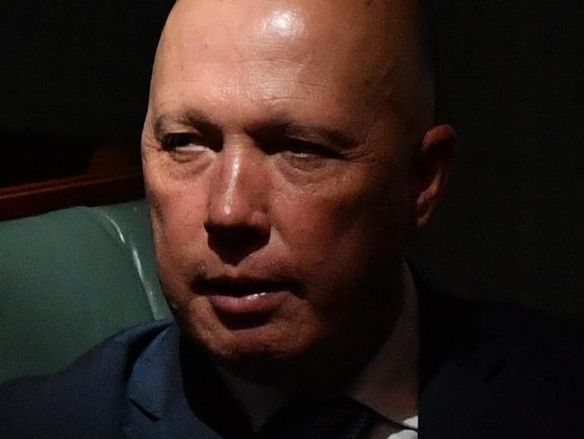 CANBERRA, AUSTRALIA - NOVEMBER 30: Minister for Home Affairs Peter Dutton looks on during Question Time in the House of Representatives at Parliament House on November 30, 2020 in Canberra, Australia. Prime Minister Scott Morrison is attending parliament virtually while he completes 14 days of quarantine at The Lodge following his visit to Japan. (Photo by Sam Mooy/Getty Images)