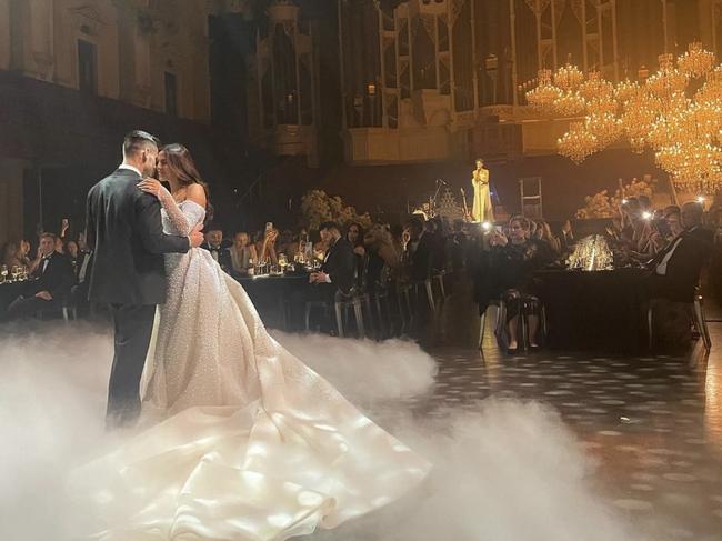 The wedding featured acrobats, a champagne tower and smoke machine.