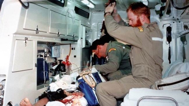 Dr Bill Griggs works on shooting victim, STAR group senior constable Derrick McManus. Derrick was shot 14 times by Tony Grosser. Picture: Supplied