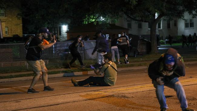 Graphic images of the shooting show one of the shot men and another backing away as Rittenhouse raises his rifle. Picture: Tayfun Coskun/Anadolu Agency via Getty Images)